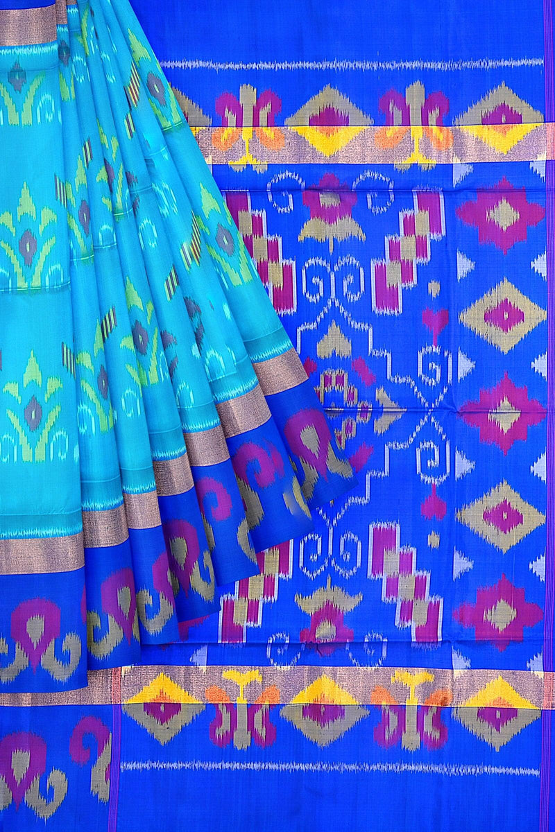 Kanchivaram handloom saree with the body in teal blue, pallu & border in dark blue color with geometrical Ikkat motifs in half-fine zari.
