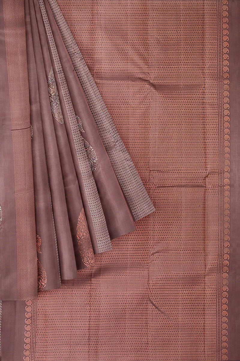 Brown kanchivaram soft silk saree with silver and copper zari in geometrical and paisley motifs.