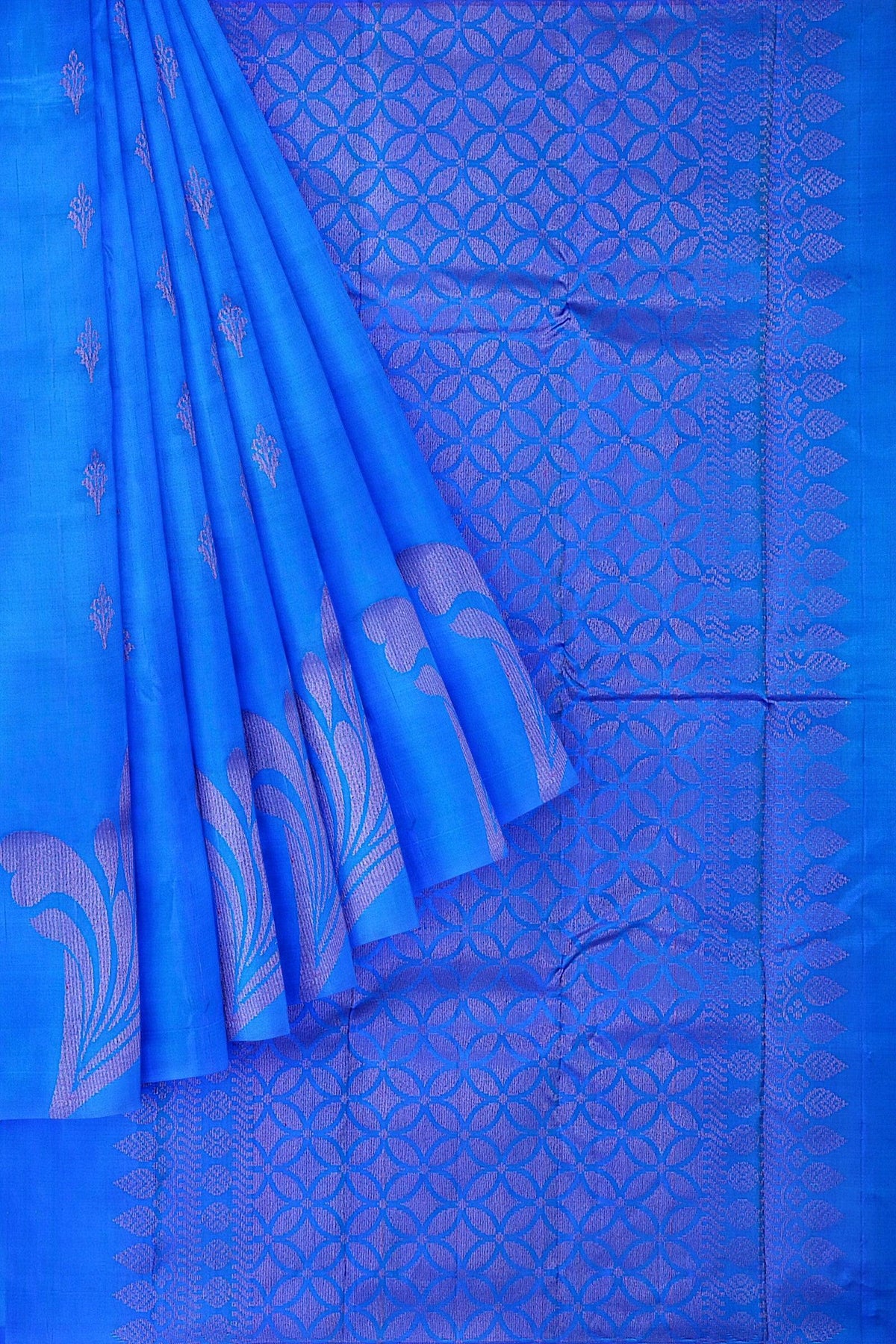 An elegant Kanchivaram handloom saree with the body & pallu in dark blue color with floral motifs in neem zari.