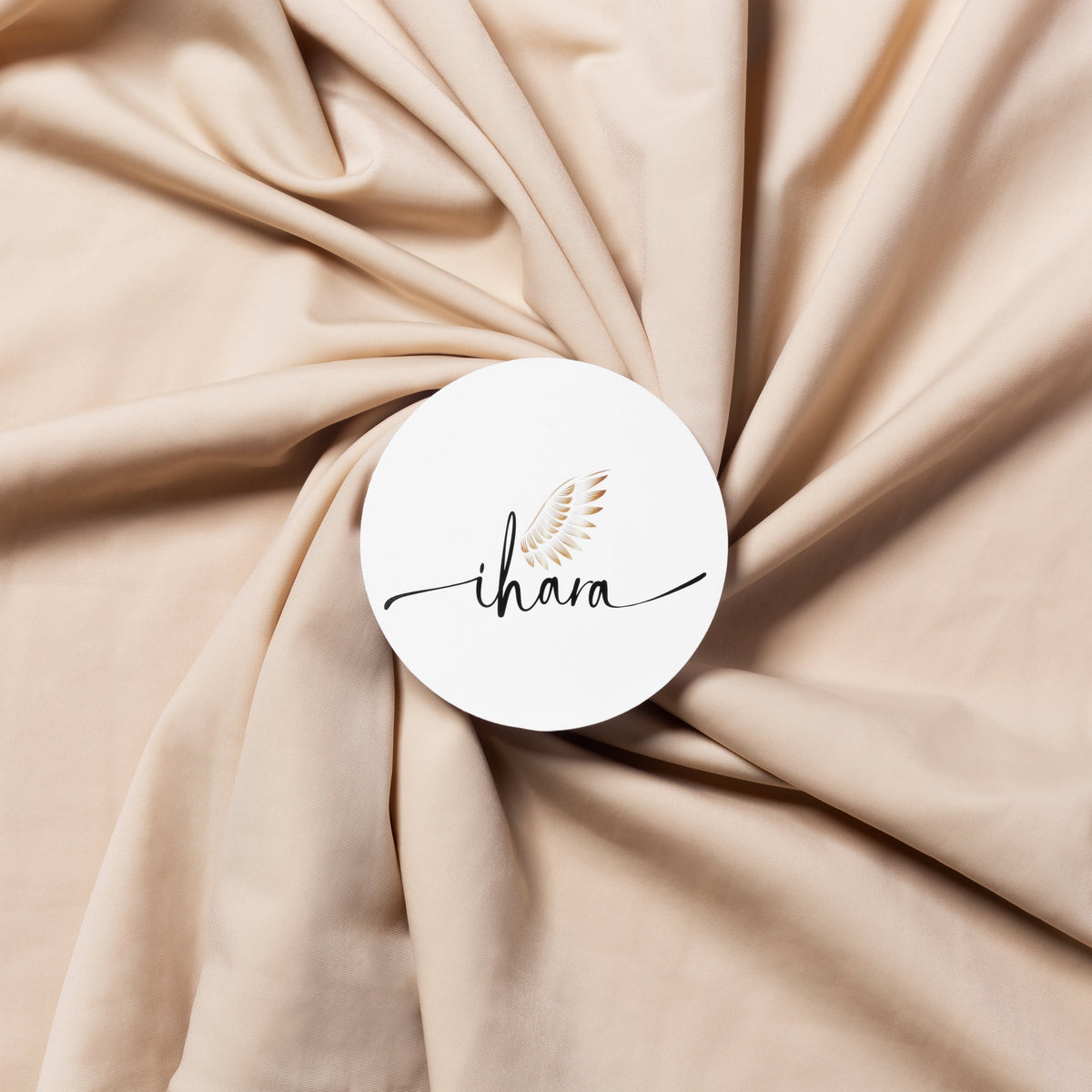 A blend of nylon spandex knitted fabric material in beige or nude color used to design Saree Shapers.